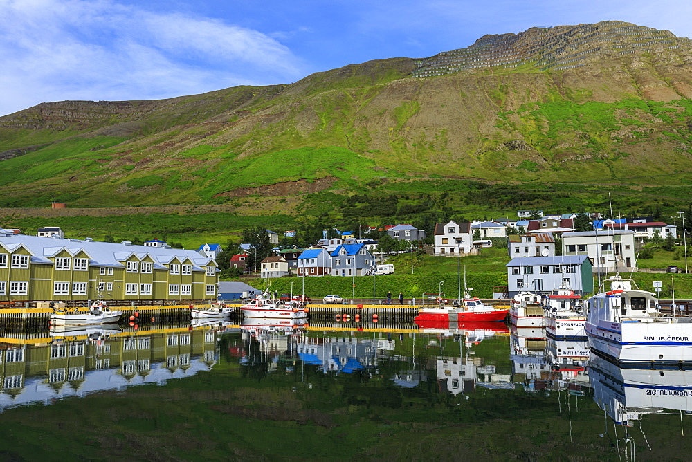 Harbour, hotel and fishing boats, mountains, reflections, Siglufjordur, (Siglufjorour), stunning Summer weather, North Iceland, Europe