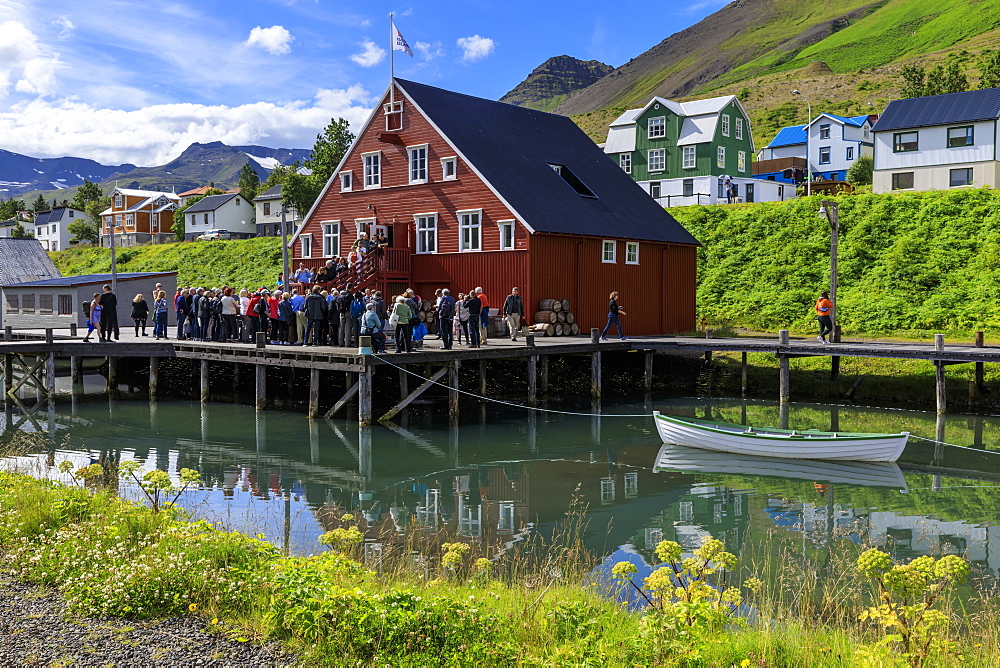 Tourists at the busy, award-winning Herring Era Museum, Siglufjordur, (Siglufjorour), stunning Summer day, North Iceland, Europe