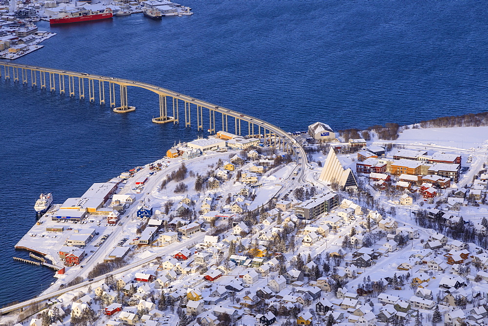 Sunlit Tromsdalen, Arctic Cathedral and Tromso Bridge, fresh snow, elevated view from Mount Storsteinen in winter, Troms, Norway, Scandinavia, Europe