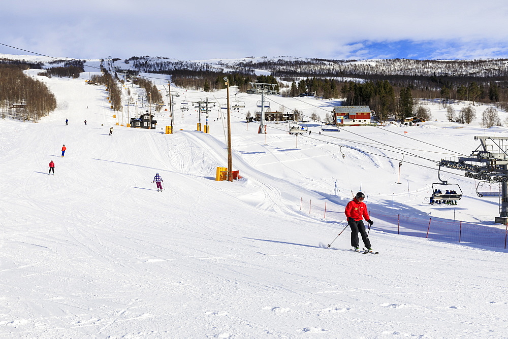 Bjorli Village, skiers, piste and chair lift, early snow ski resort, winter sun, Gudbrandsdalen Valley, Oppland, Norway, Scandinavia, Europe