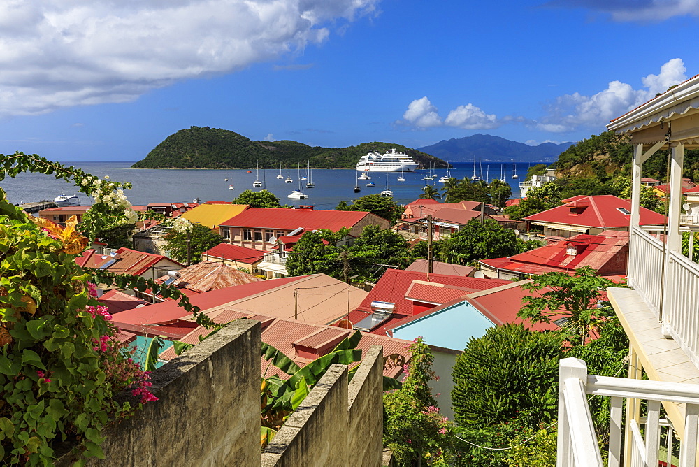 View to beautiful Les Saintes Bay across red roofs of town, Terre de Haut, Iles Des Saintes, Guadeloupe, Leeward Islands, West Indies, Caribbean, Central America