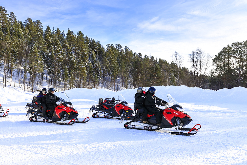 Snowmobile adventure, Alta Northern Lights tourists, winter snow and sun, Troms og Finnmark, Arctic Circle, North Norway, Scandinavia, Europe