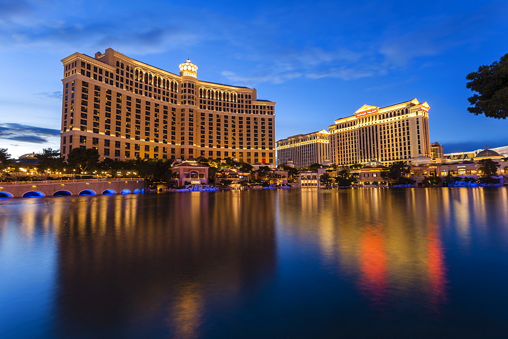 Bellagio and Caesars Palace reflections at dusk, The Strip, Las Vegas, Nevada, United States of America, North America 