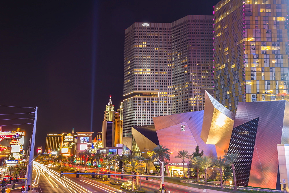 Neon lights, Las Vegas Strip South at night with cars leaving light streaks in front of City Center, Las Vegas, Nevada, United States of America, North America 