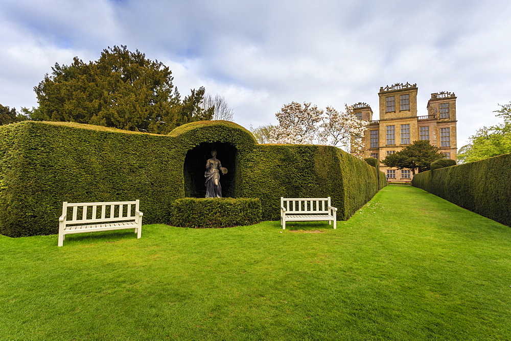 Yew hedge, seats and sculpture in spring at Hardwick Hall, near Chesterfield, Derbyshire, England, United Kingdom, Europe