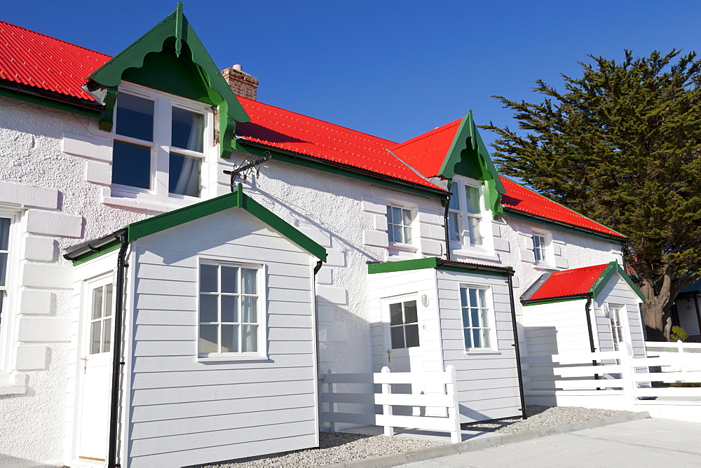 Red and white stone houses of Marmont Row, Victory Green, Stanley, Port Stanley, East Falkland, Falkland Islands, South America