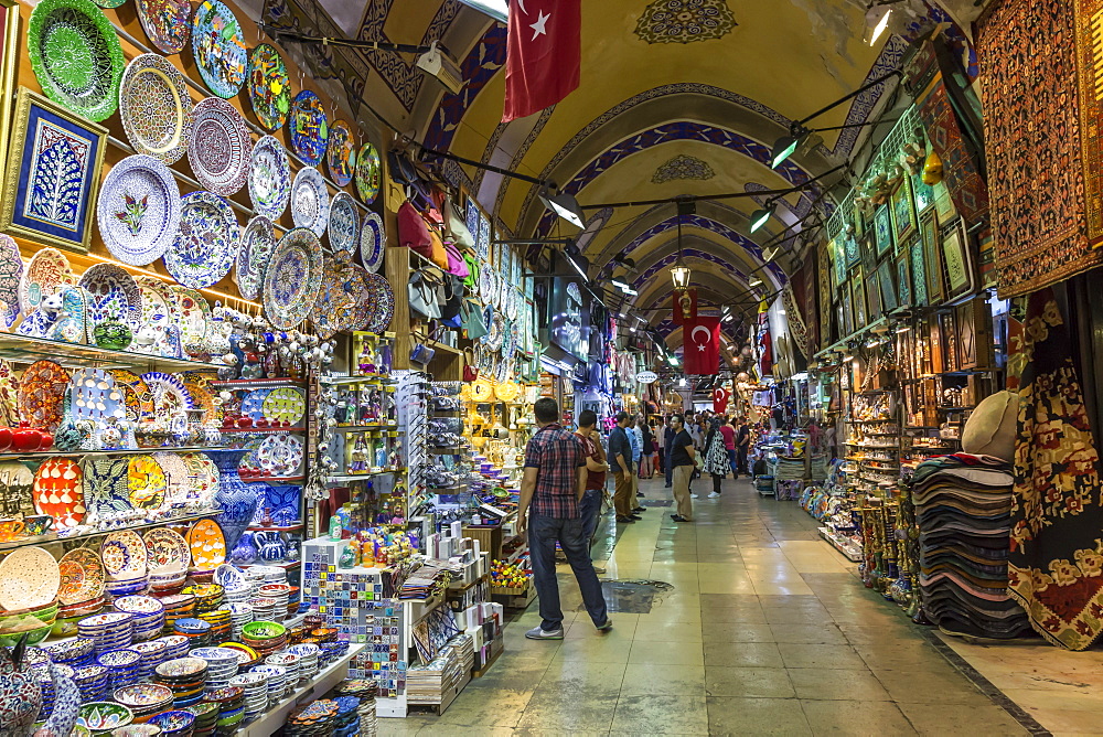 Shops and sellers (vendors) selling Turkish pottery, carpets, kilims, Grand Bazaar, Istanbul, Turkey, Europe