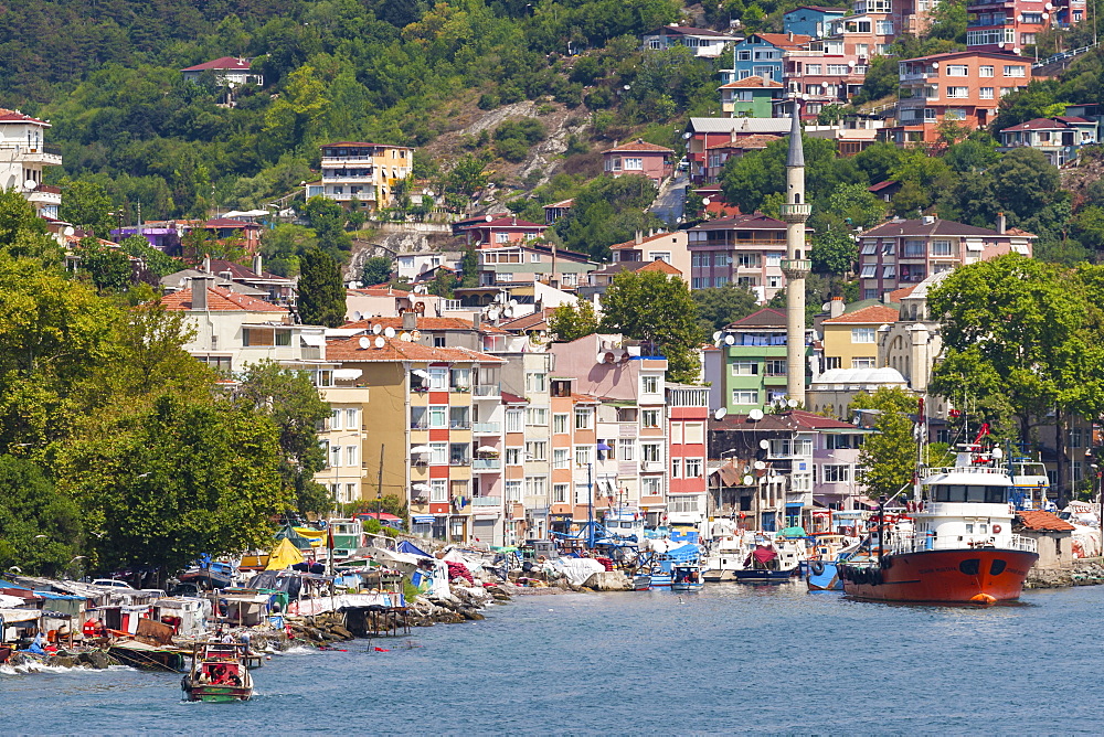 Fishermen and fishing boats, minaret and apartments, Rumeli Kavagi, Upper Bosphorus Strait (European Side), Istanbul, Turkey, Europe