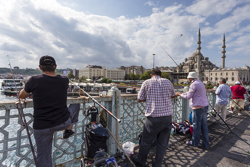 Fishermen, their rods and New Mosque, Galata Bridge, Golden Horn, Eminonu to Galata, Istanbul, Turkey, Europe