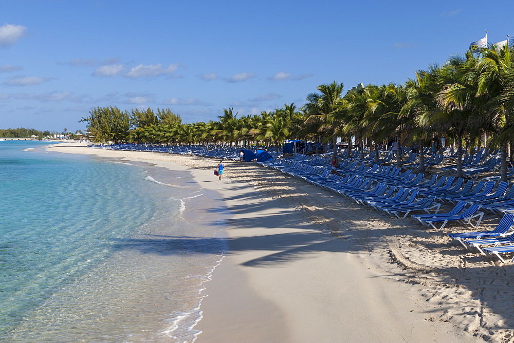 Tourist on a white sand beach, palm trees and empty sun loungers, cruise terminal, Grand Turk, Turks and Caicos, West Indies, Caribbean, Central America