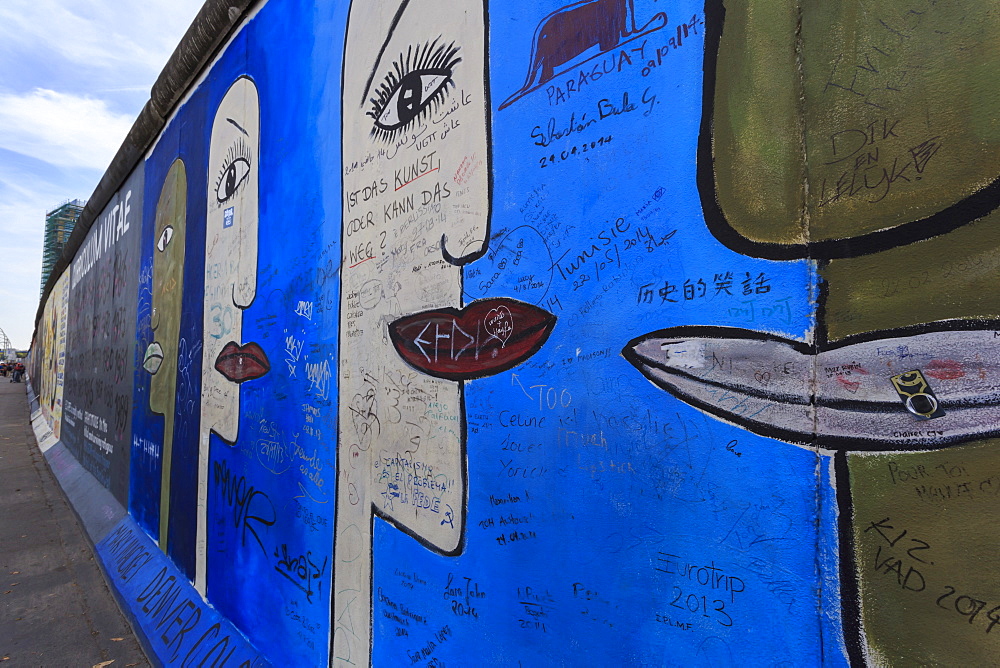 Graffiti on mural Tolerance by Mary Mackey, Berlin Wall, East Side Gallery, Muhlenstrasse, Friedrichshain, Berlin, Germany, Europe