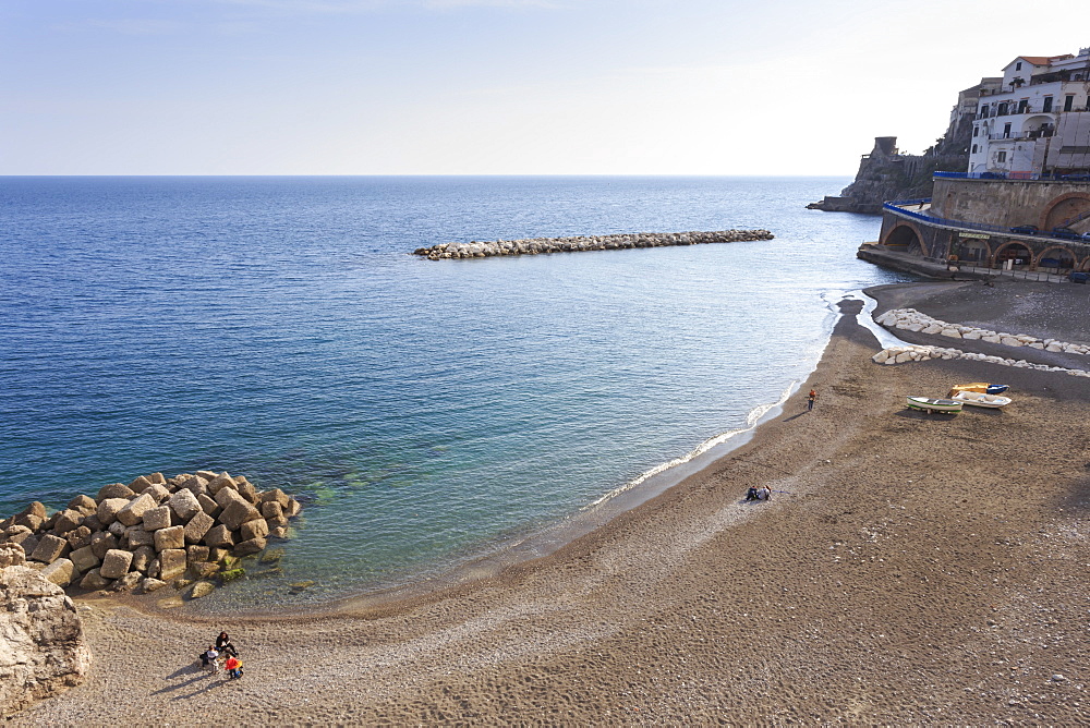 Elevated view of Atrani beach with family and fishing boats, near Amalfi, Costiera Amalfitana (Amalfi Coast), UNESCO World Heritage Site, Campania, Italy, Europe