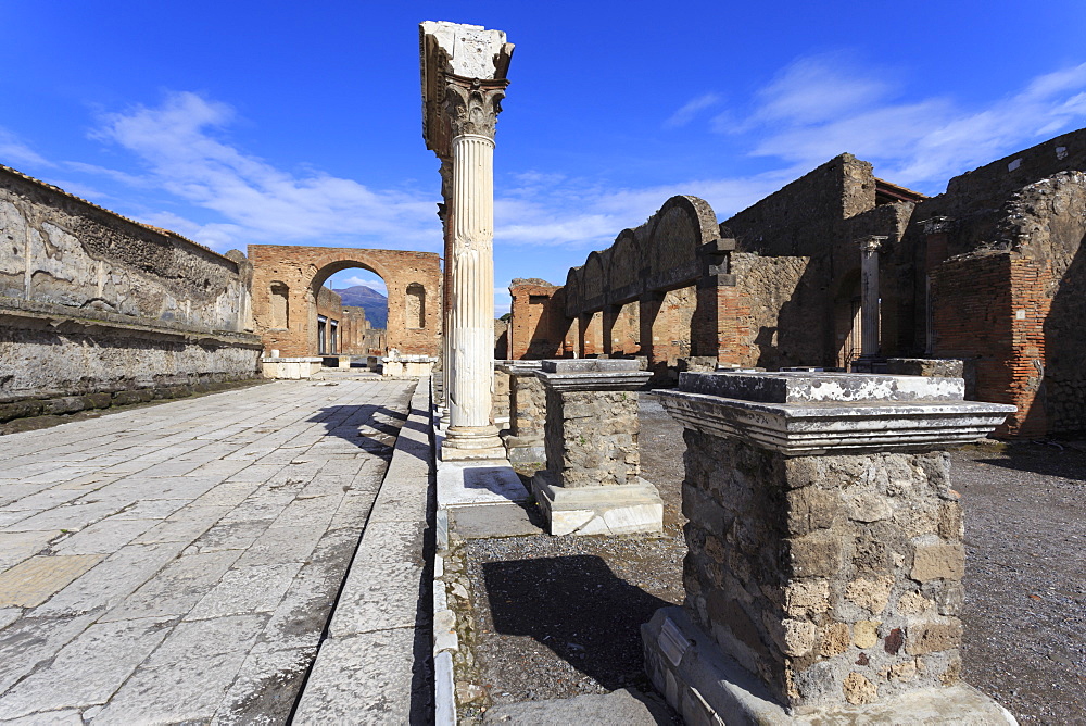 Forum and Vesuvius through arch, Roman ruins of Pompeii, UNESCO World Heritage Site, Campania, Italy, Europe