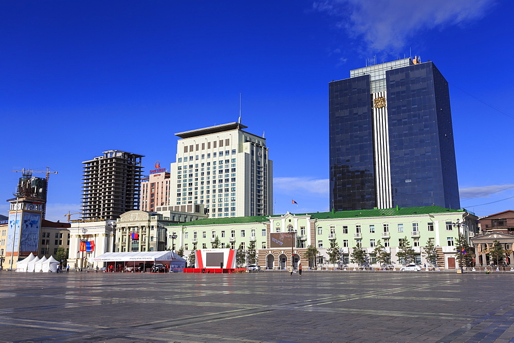 Old and new buildings around Chinggis Khaan (Sukhbaatar) Square under blue sky, morning, Ulaanbaatar (Ulan Bator), Mongolia, Central Asia, Asia