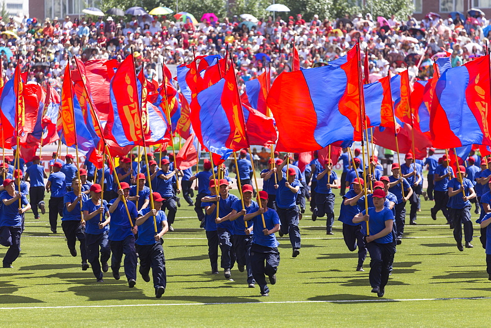 Young men run with Mongolian flags, Naadam Stadium, Naadam Festival Opening Ceremony, Ulaan Baatar (Ulan Bator), Mongolia, Central Aisa, Asia