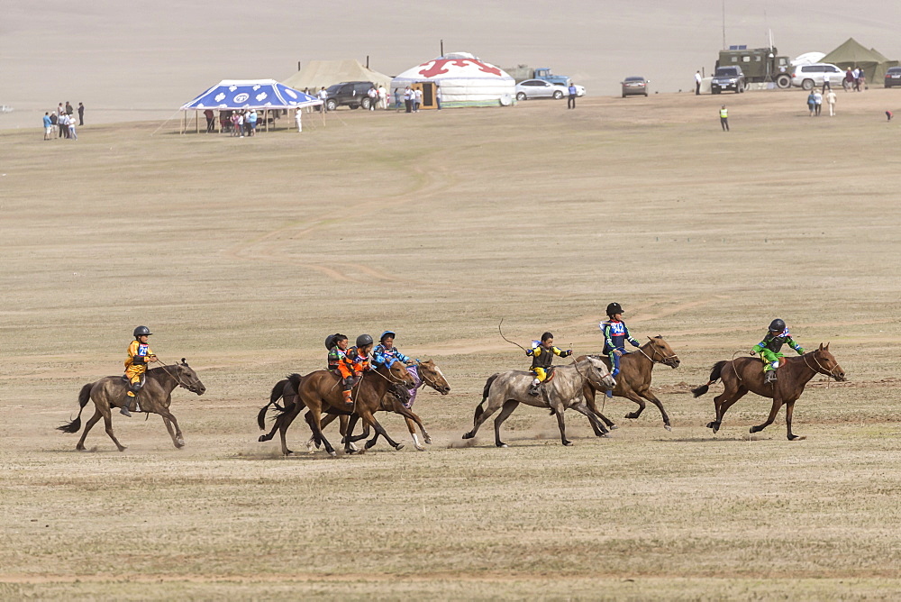 Child jockeys in a dash for the line, five-year old horse race, Naadam Festival, Hui Doloon Khutag, Ulaan Baatar, Mongolia, Central Asia, Asia