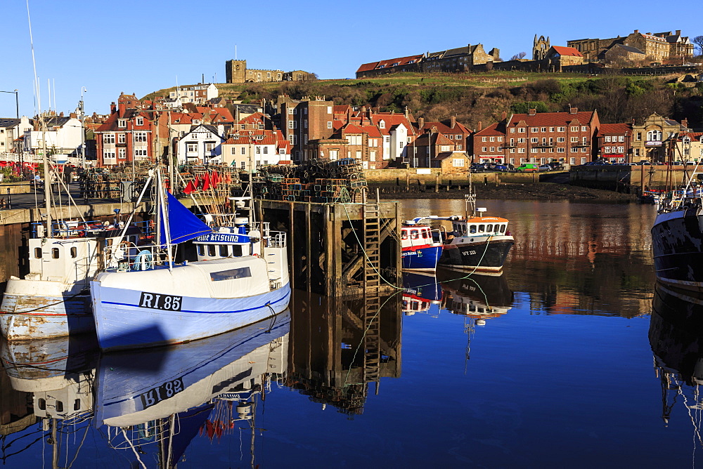 St. Mary's Church and reflections at Endeavour Wharf with lobster pots and boats, Upper Harbour, Whitby, North Yorkshire, England, United Kingdom, Europe