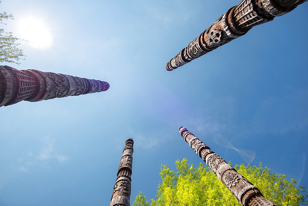 Four Naxi poles with wood carvings, Lijiang, Yunnan, China, Asia 