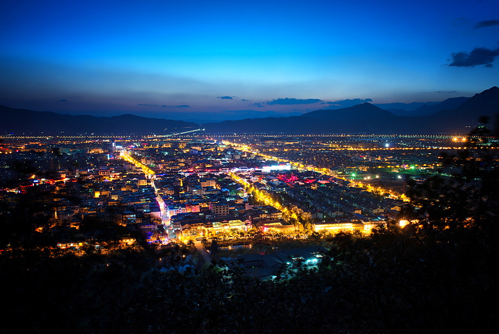 City lights of Lijiang as seen from Elephant Mountain, Lijiang, Yunnan, China, Asia 