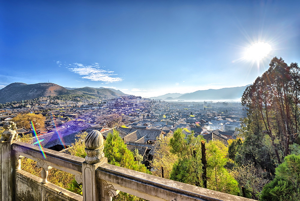 Dayan, the Old Town of Lijiang, and the hill towards the left is Xiangshan (Elephant Hill), Lijiang, Yunnan, China, Asia 