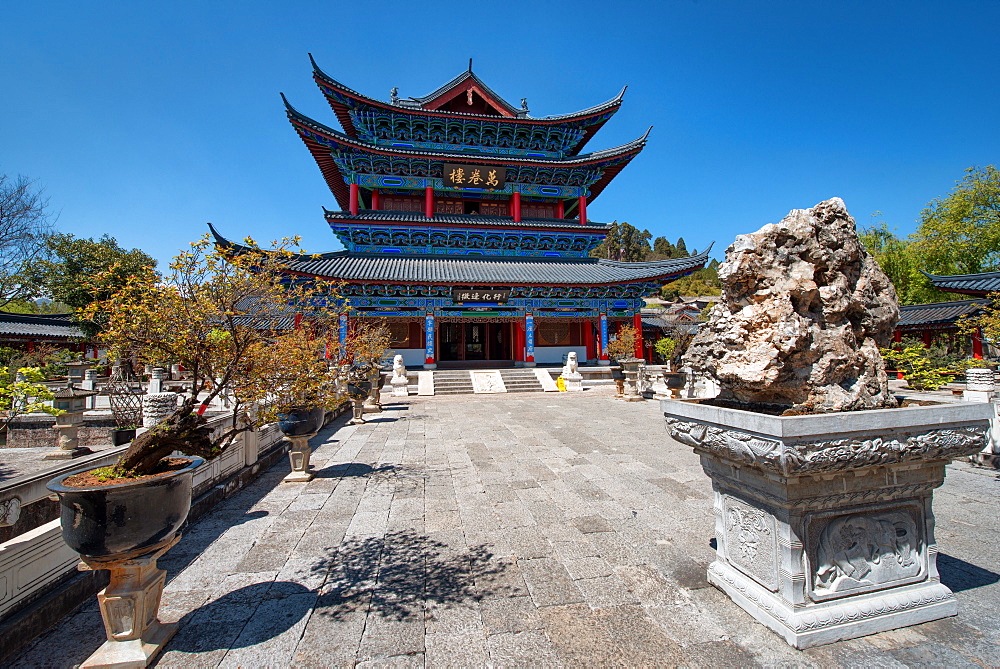 Wanjuan Pavilion at Mufu Wood Mansion with lined up potted bonsai and rocks, Lijiang, Yunnan, China, Asia 