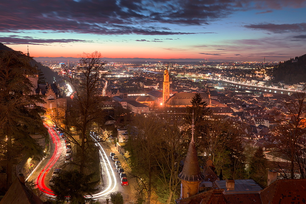 Elevated nightly view of Heidelberg Altstadt (Old Town) with spires and light trails, Heidelberg, Baden-Wurttemberg, Germany, Europe 