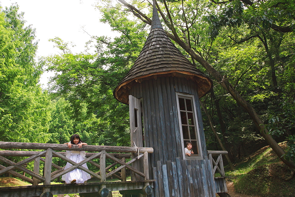 Children Playing in Wooden House