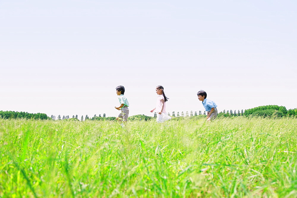 Children Playing with Rope in Park