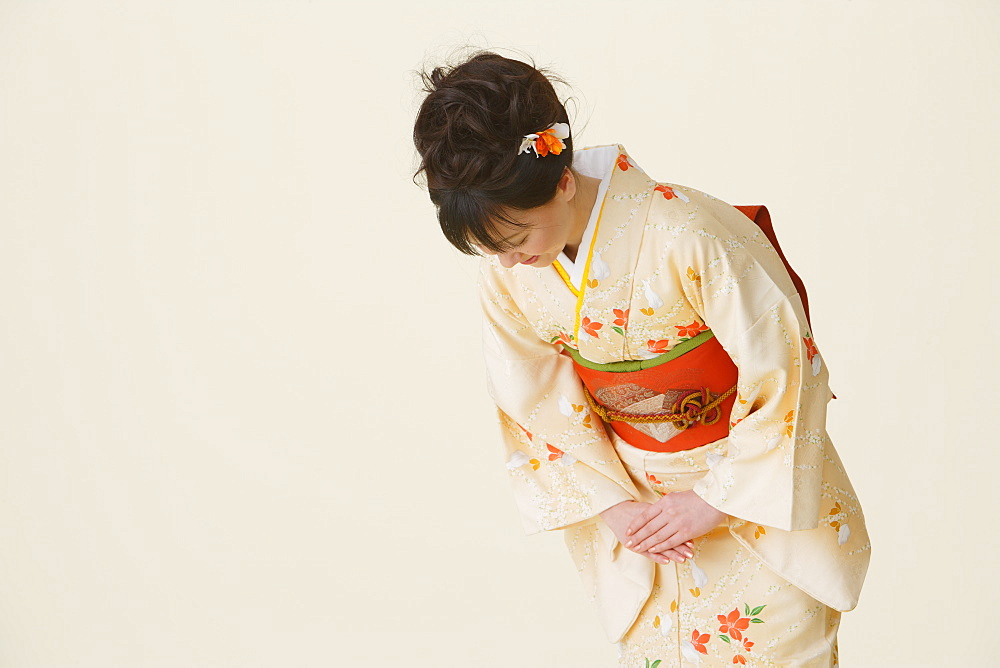 Woman Wearing Kimono Bowing