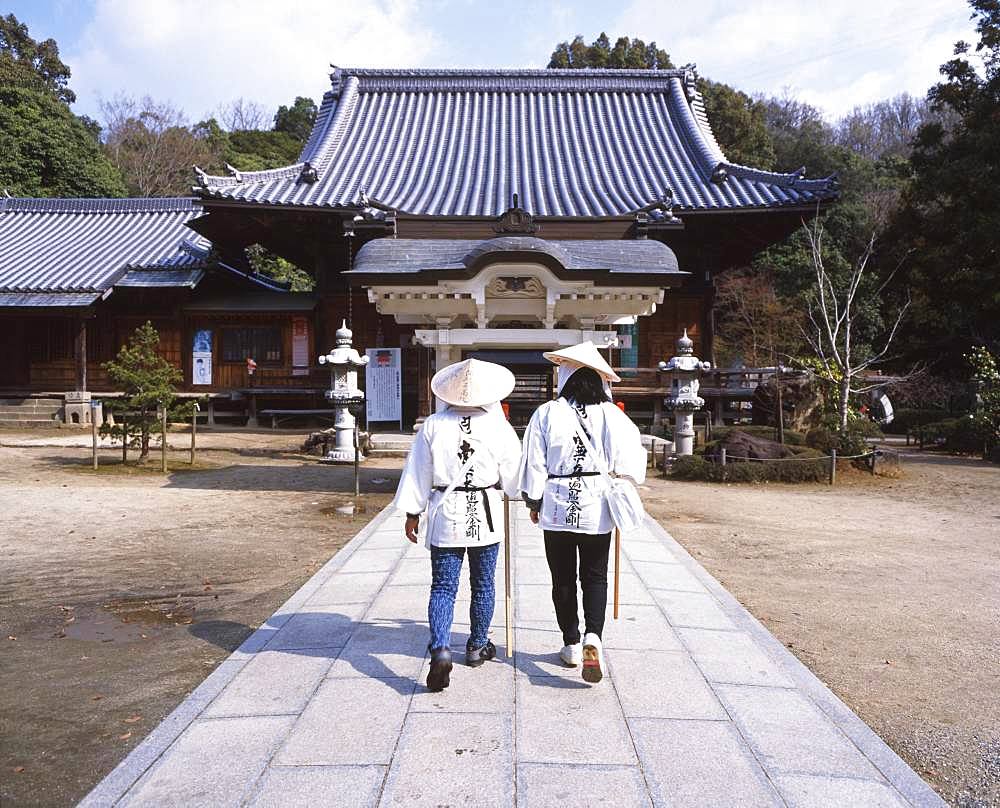 Two women in tradtional Japanese clothes at temple, Tokushima, Japan