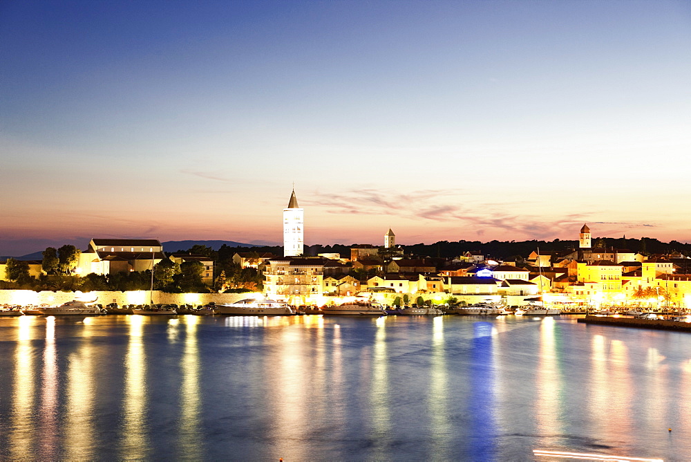 View of Rab cityscape and Adriatic sea at dusk in Croatia