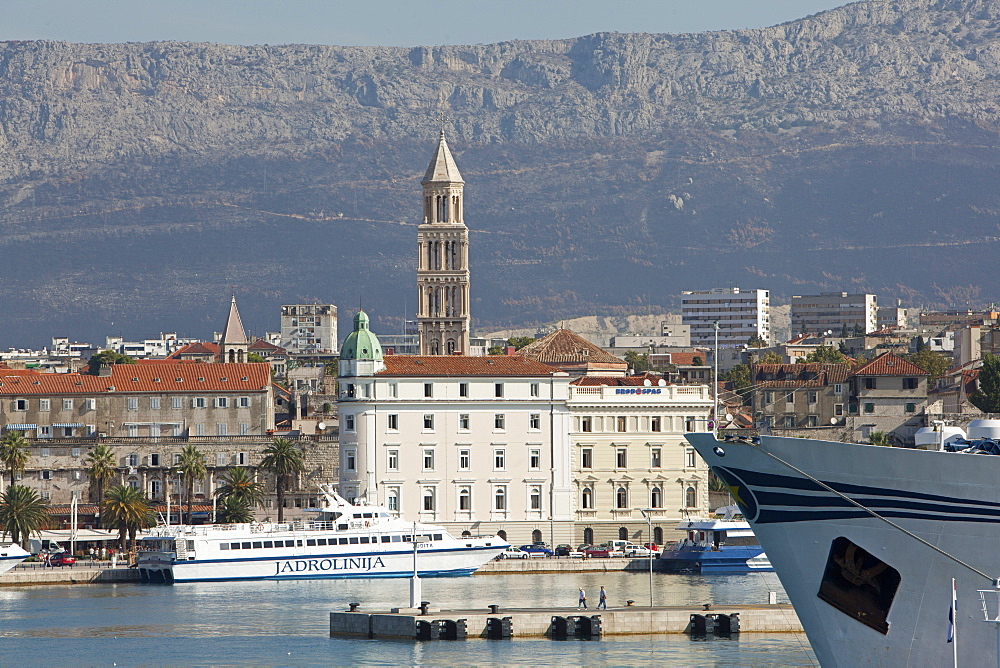 View of old town and ferry in Adriatic sea, Dalmatia, Croatia