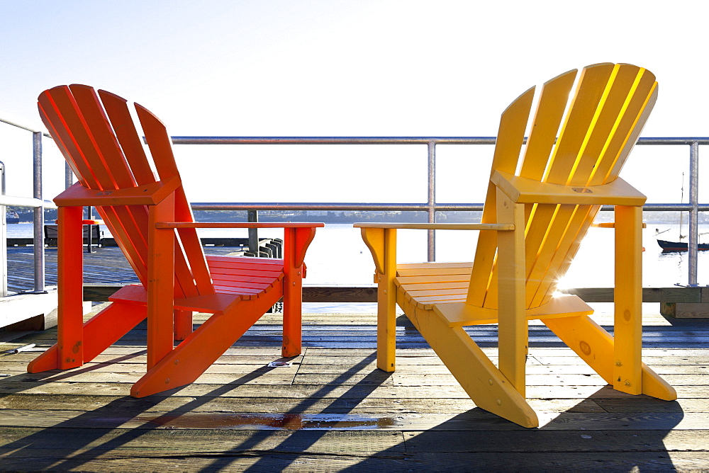 Red and yellow chair on deck at Halifax Regional Municipality, Nova Scotia, Canada