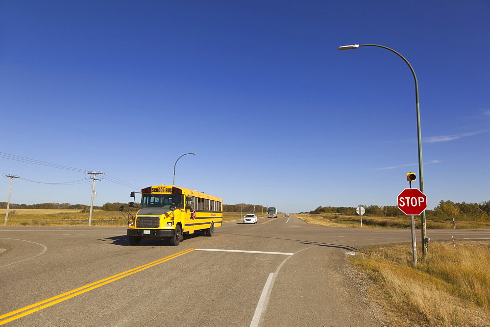 School bus crossing Highway 15 and 35, Saskatchewan, Canada