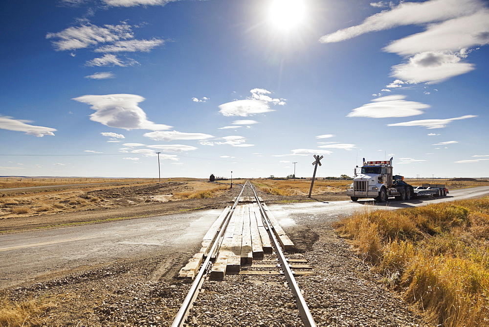 Truck on railway crossing highway 13 West, Saskatchewan, Canada