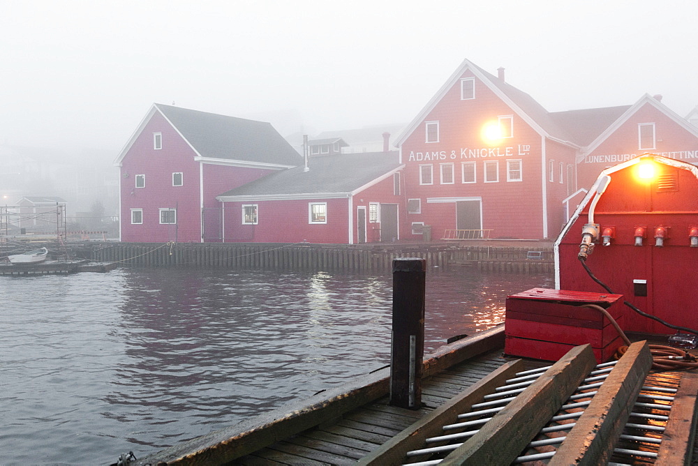 Fog in morning light at Lunenburg Harbour, Nova Scotia, Canada