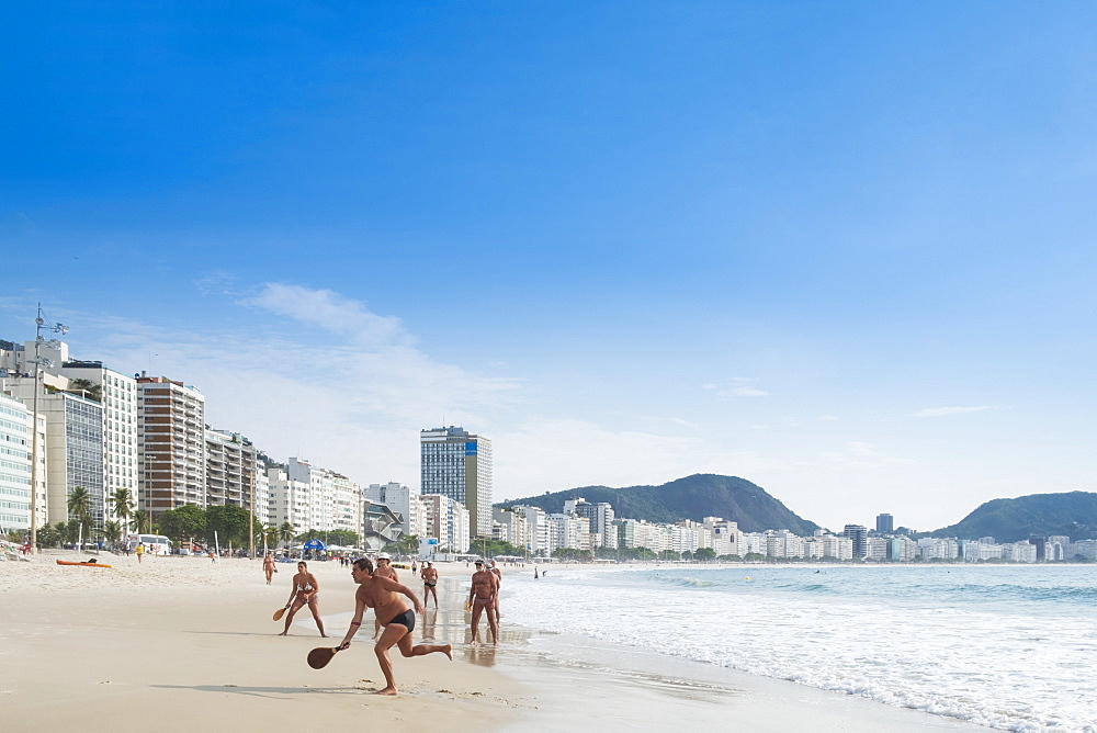 Locals playing frescobol (Matkot) in the morning on Copacabana Beach, Rio de Janeiro, Brazil, South America