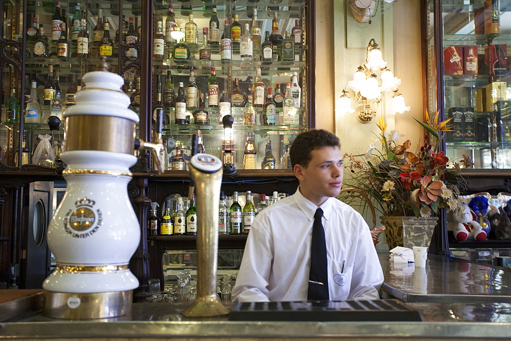 A bar man in a traditional boteco bar in central Rio de Janeiro, Brazil, South America