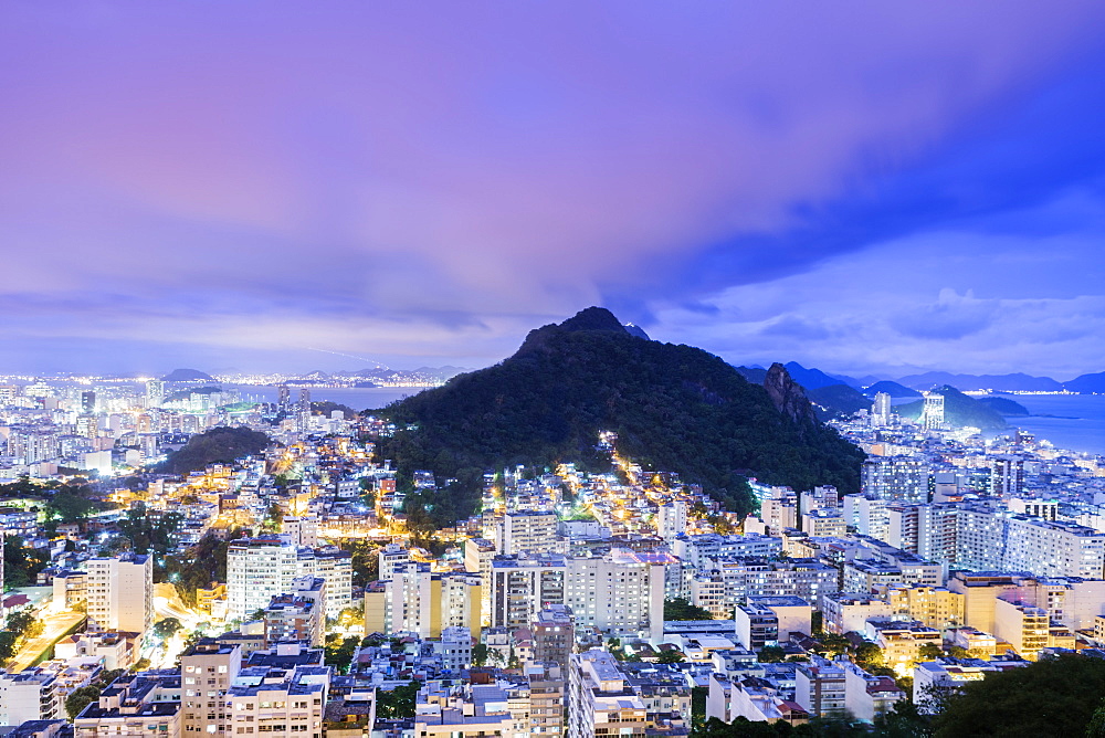 Twilight, illuminated view of Copacabana, the Morro de Sao Joao, Botafogo and the Atlantic coast of Rio, Rio de Janeiro, Brazil, South America