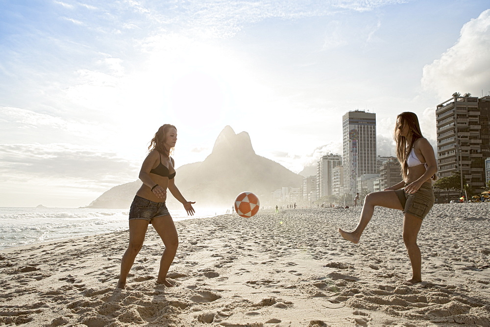 Women playing altinha (football) on Ipanema beach, Rio de Janeiro, Brazil, South America