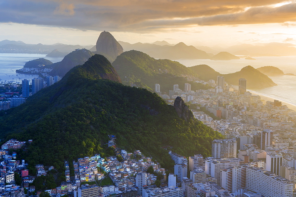 View of the Sugar Loaf, Sao Joao favela, Guanabara bay, the Atlantic and the mountains of Rio and Niteroi, Rio de Janeiro, Brazil, South America