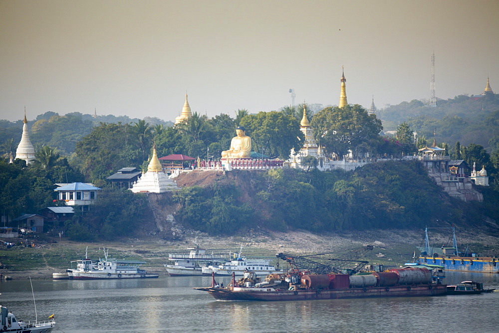 View of buddhist temples on Sagaing hill and the Irrawaddy or Ayeyarwady river from the Mandalay side of the river, Sagaing, Myanmar (Burma), Southeast Asia