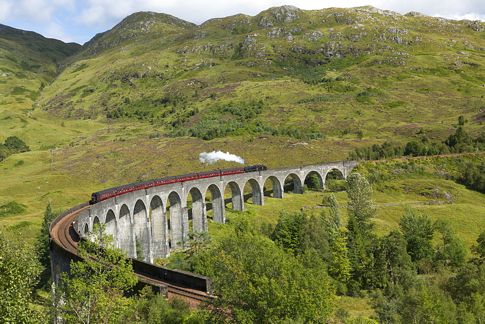 The Jacobite steam train on the Glenfinnan Viadust on the Fort William to Mallaig Railway, Highlands, Scotland, United Kingdom, Europe