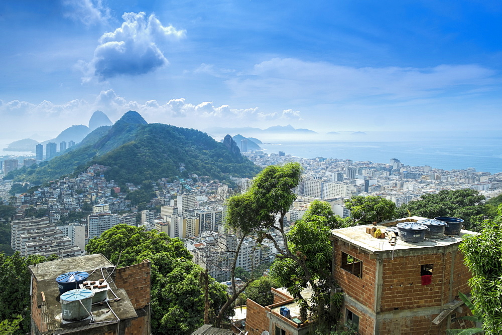 Rio de Janeiro from Cabritos favela in Copacabana, Moro Sao Joao and Sugar Loaf in the foreground, Copacabana right of frame, Rio de Janeiro, Brazil, South America