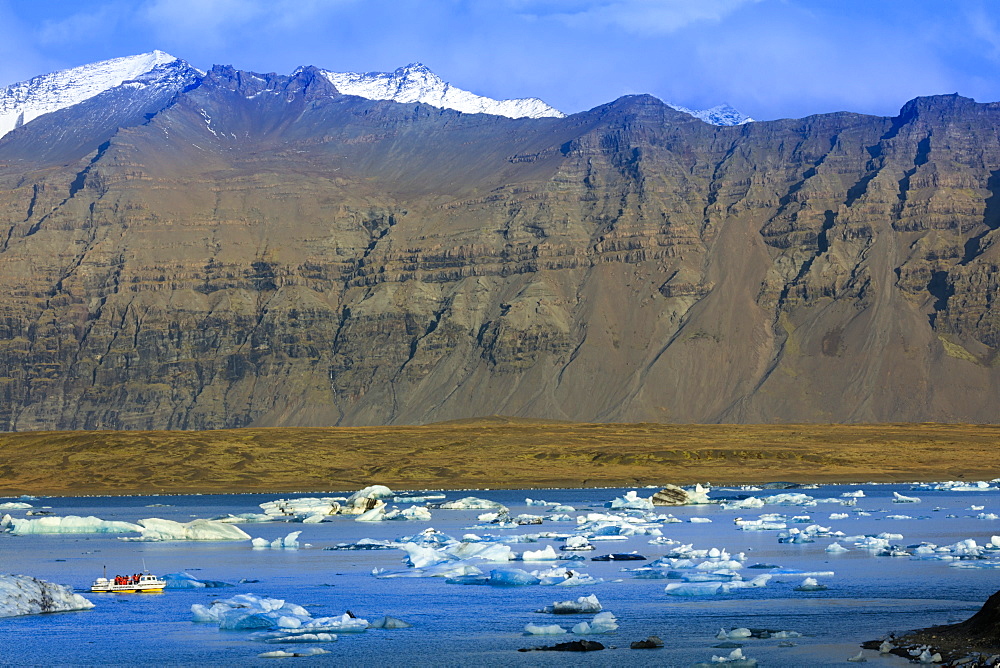 Tourist boat in icebergs in the Jokulsarlon glacial lake in Vatnajokull National Park in southeast Iceland, Polar Regions