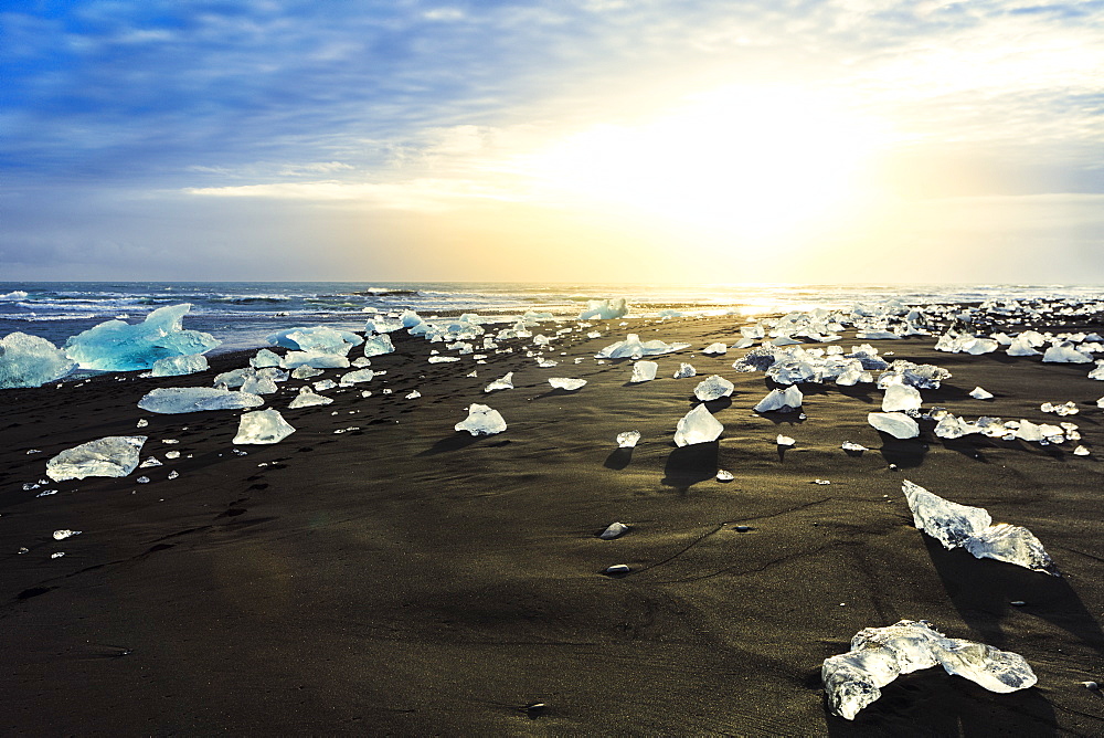 Icebergs on a black sand volcanic beach next to the Jokulsarlon glacial lake in Vatnajokull National Park, southeast Iceland, Polar Regions