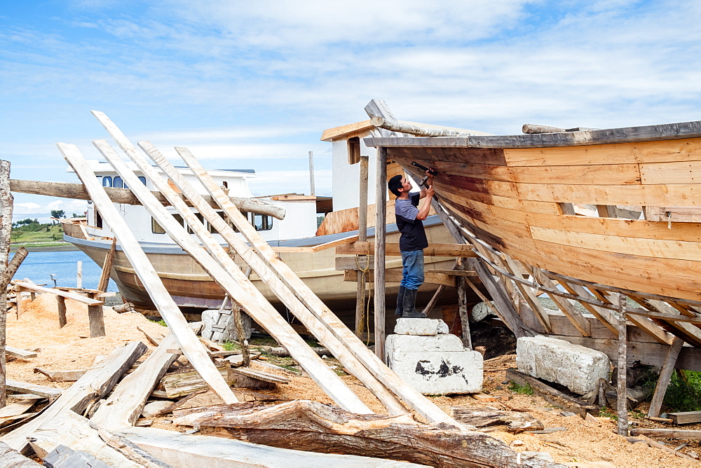 A boat-builder on Chiloe island, Northern Patagonia, Chile, South America