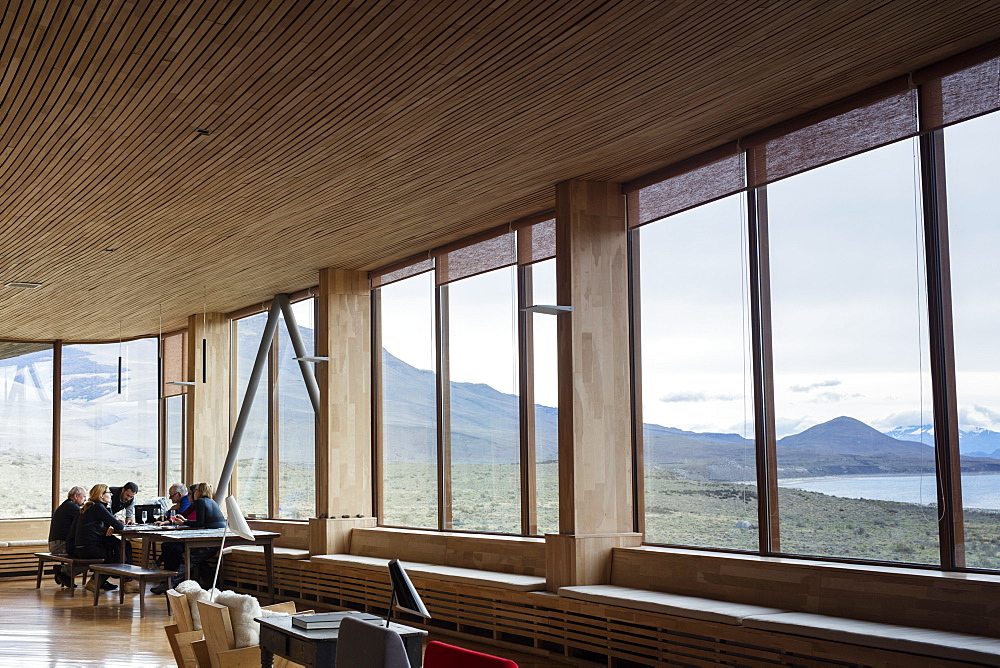 Tourists sitting in the lounge area of the Tierra Patagonia Hotel in the Torres del Paine region, Patagonia, Chile, South America