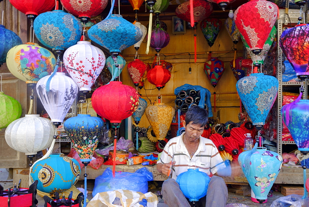 A man making paper lanterns in a shop in Hoi An, Vietnam, Indochina, Southeast Asia, Asia