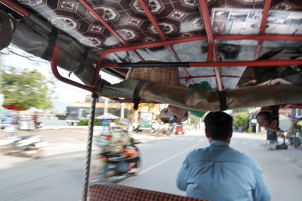 Tuk tuk driver in the streets of Kampt Town, Cambodia, Indochina, Southeast Asia, Asia